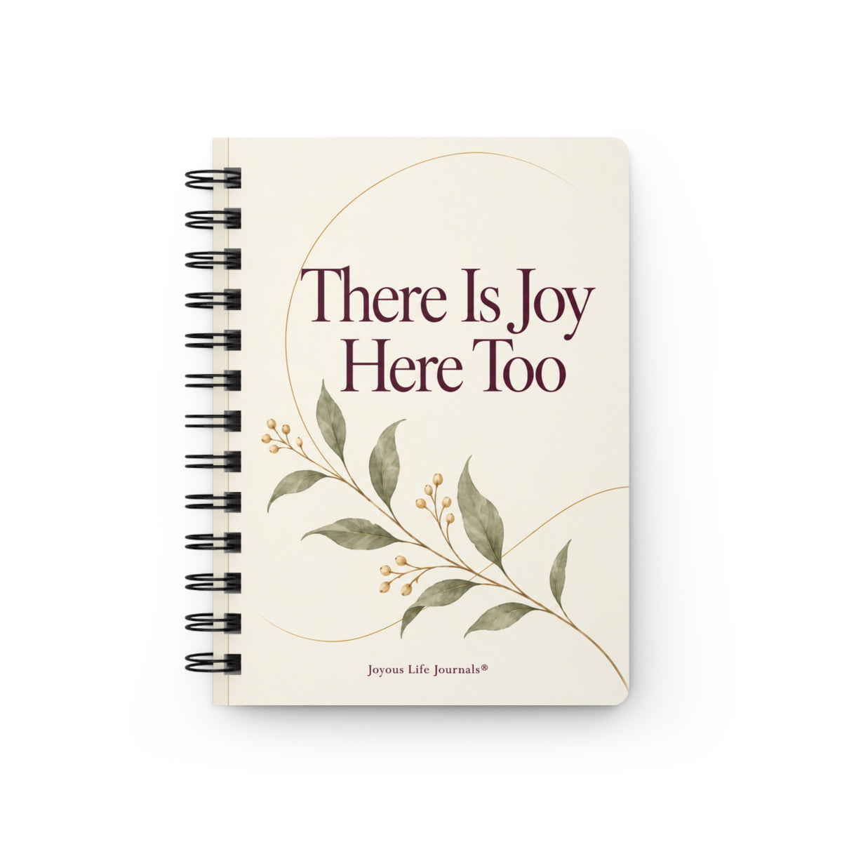 A cream-colored spiral-bound journal with the text 'There Is Joy Here Too' and a delicate botanical illustration, shown on a clean white background.