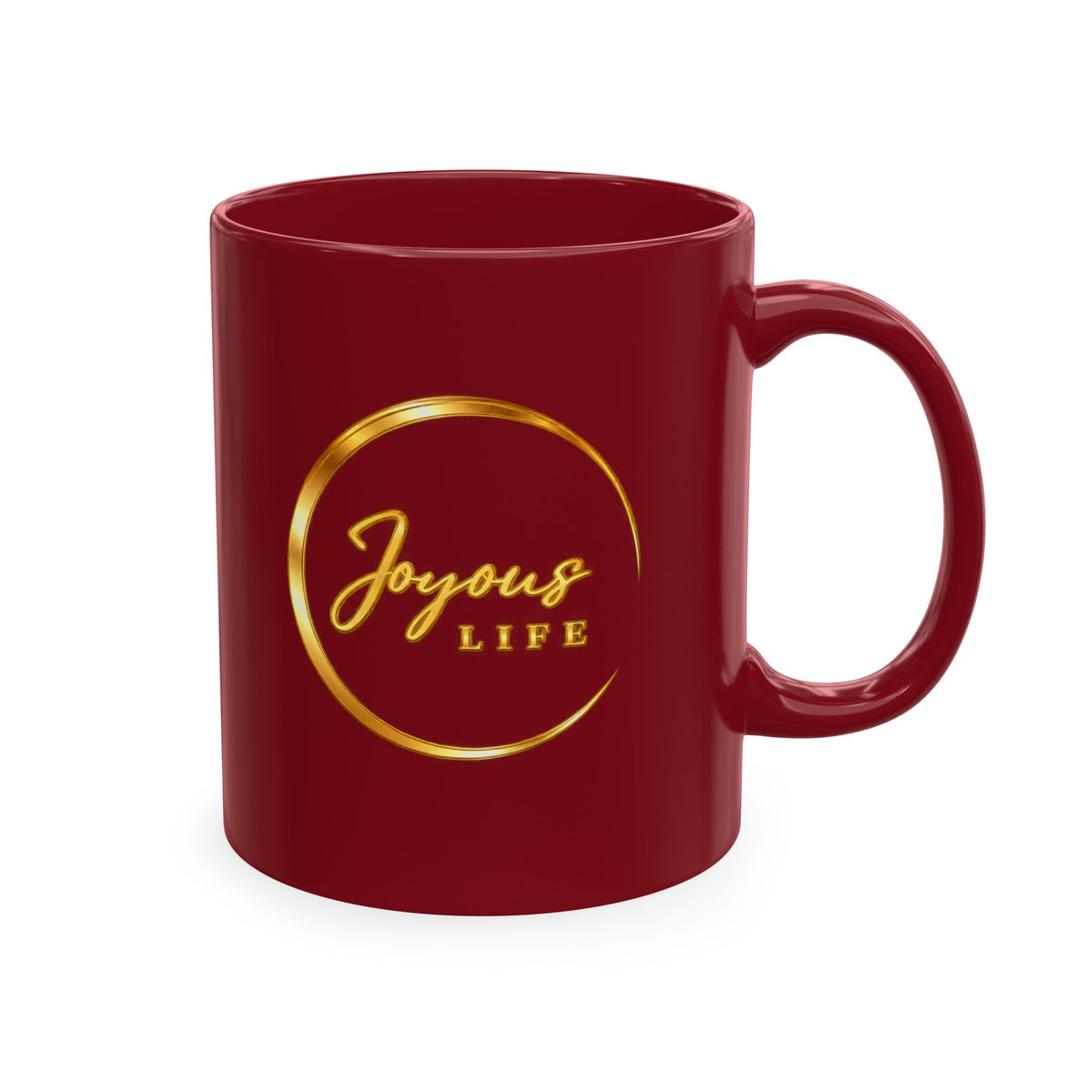 Two views of the Joyous Life Signature burgundy ceramic mug featuring the gold-look circular Joyous Life logo.
